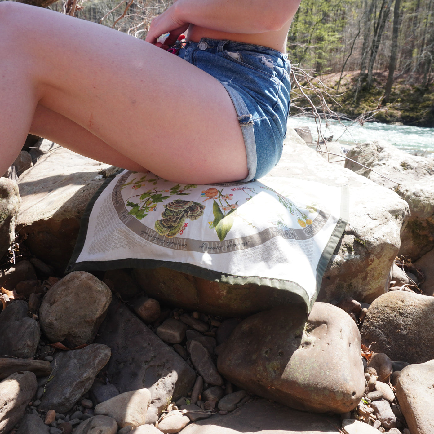 Cotton water resistant ground cloth adding comfort to a river rock seat