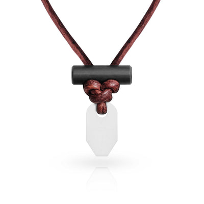 A necklace with a leather strap and a two-part pendant including a ferrocerium rod and a ceramic striker, against a white background.