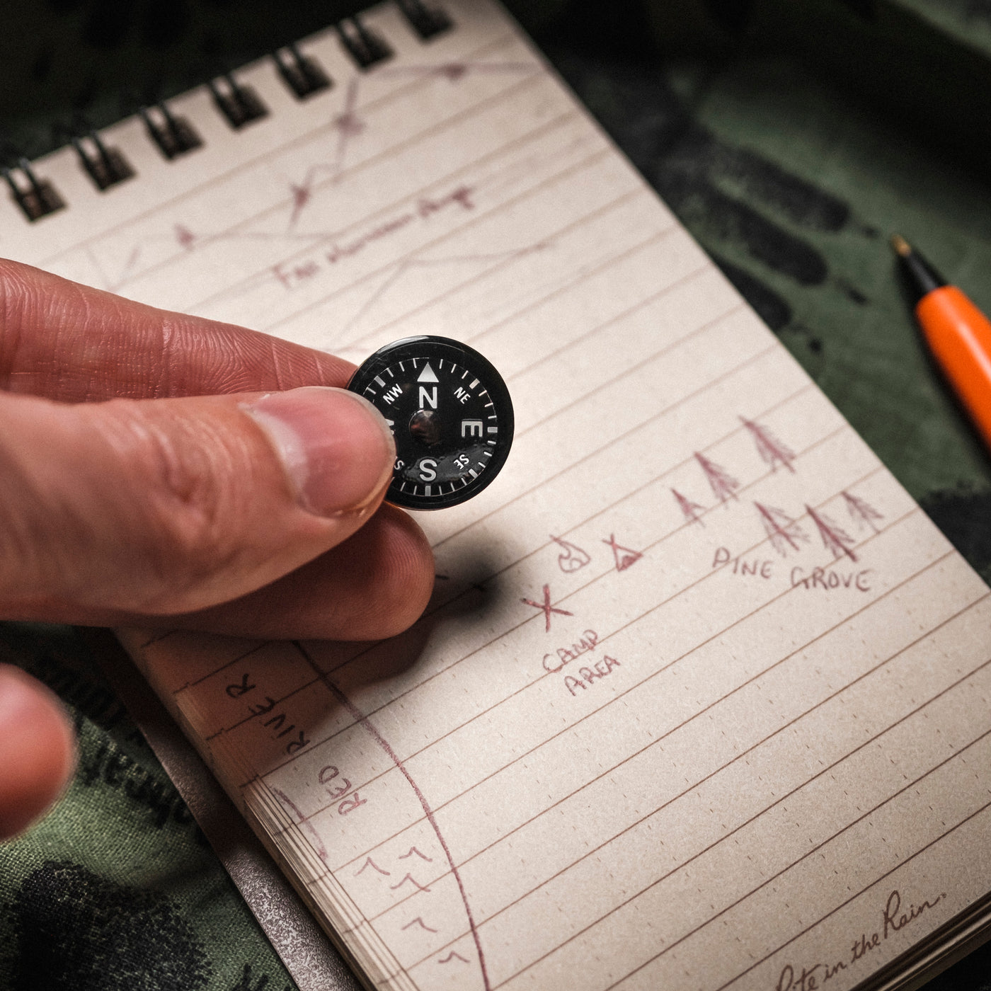 Mini Button Compass In Hand