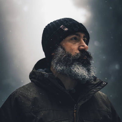 Merino Wool Cache Beanie by Wazoo in snowy outdoor setting