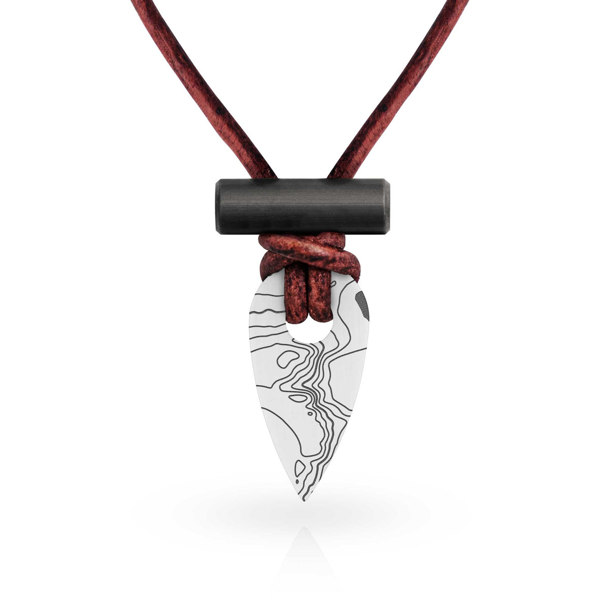 A pendant necklace featuring a topographic waypoint-shaped pendant with a black ferrocerium rod toggle, knotted on antiqued mahogany leather cord, set against a plain white background.
