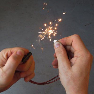 Ceramic ferro rod striker starting a fire