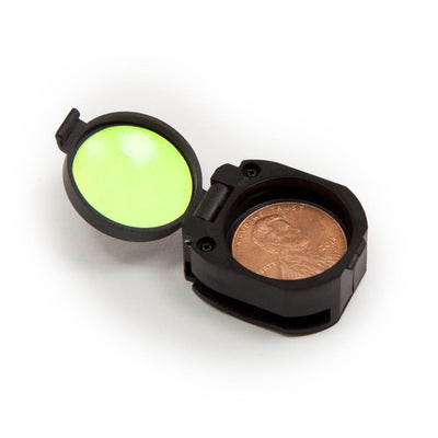 open clamshell container for holding button compass with penny inside for size reference