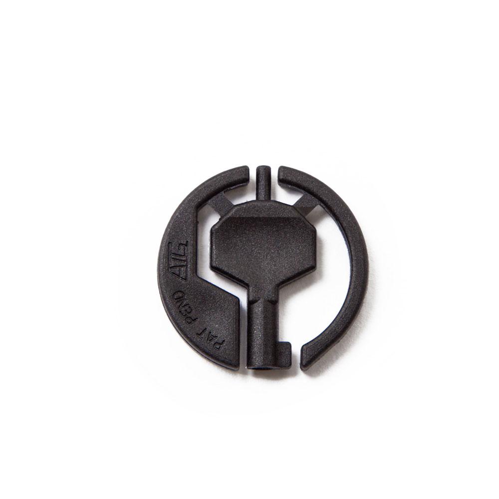 Black handcuff key with functioning double locking pin laid flat