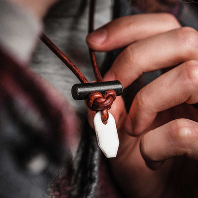 Detail of the alpine butterfly knot used to tie the Wazoo Bushcraft Necklace shown with white zirconia ceramic pendant.